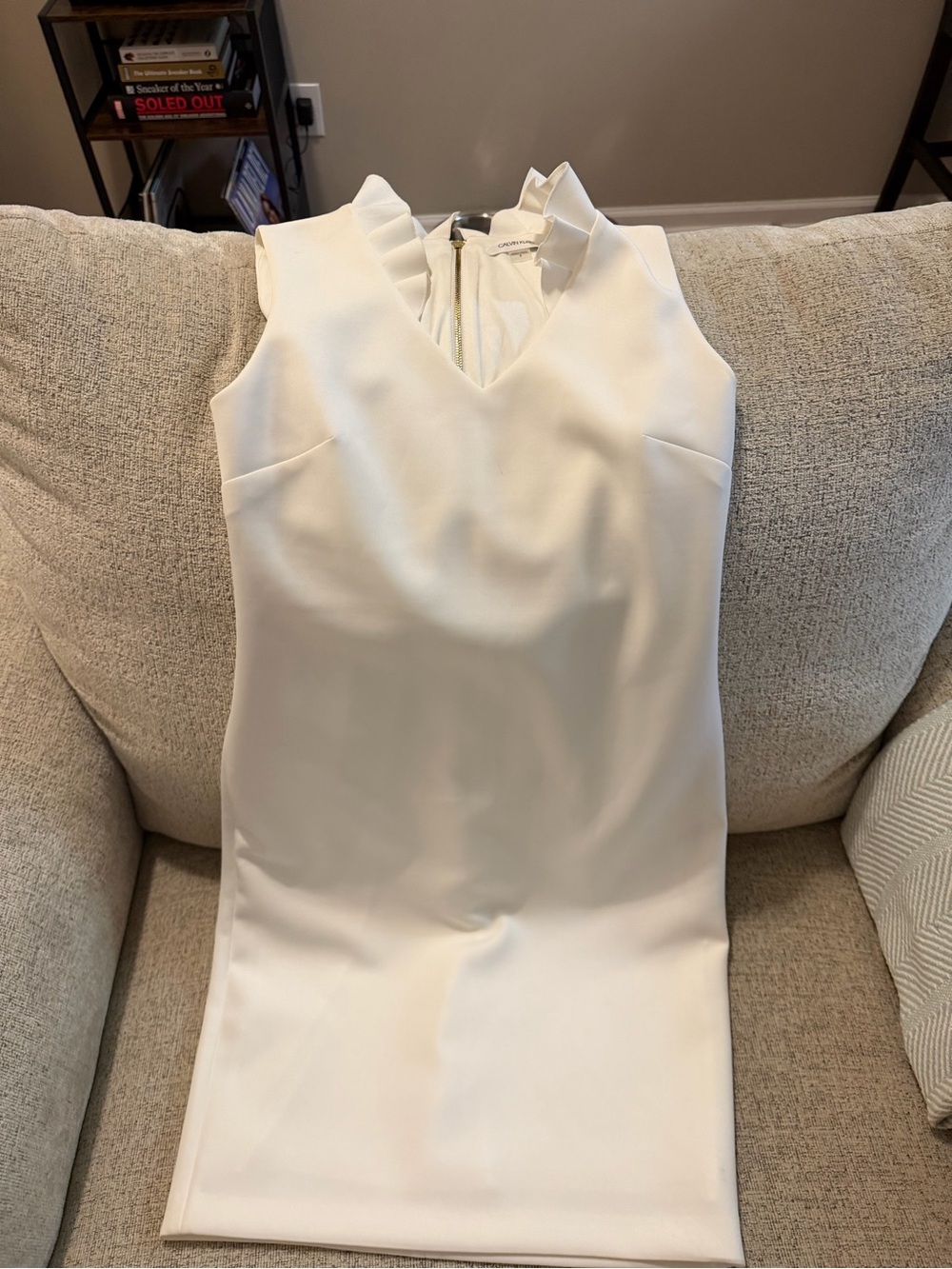 Calvin Klein white dress with a few small stains pictured
Size 8